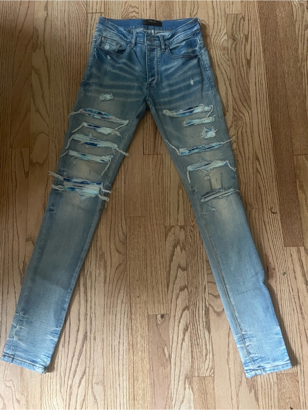 AMIRI Light Blue Skinny Distressed Jeans with Patch Detail
